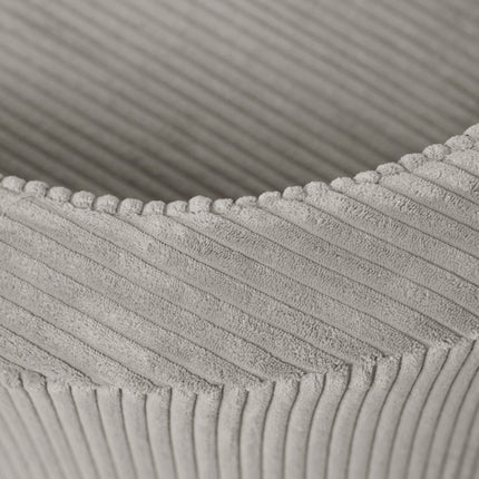 Detail corduroy stof en afgeronde vorm van de Plush Nest kinderfauteuil