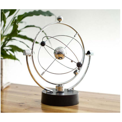 Newton cradle pendel balance magnetisch zonnestelsel